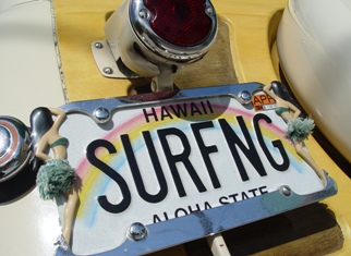 Well ... I guess we know what the owner of this vehicle does in his or her spare time!   Only in Hawaii.  Photo by Jenny W of Honolulu.  Surf's Up! 